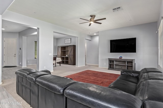 11874 N Raphael Way, Tucson, AZ 85742 - living room featuring a ceiling fan and baseboards