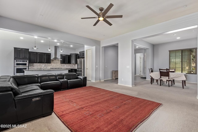 11874 N Raphael Way, Tucson, AZ 85742 - living room with light carpet, ceiling fan, baseboards, and recessed lighting