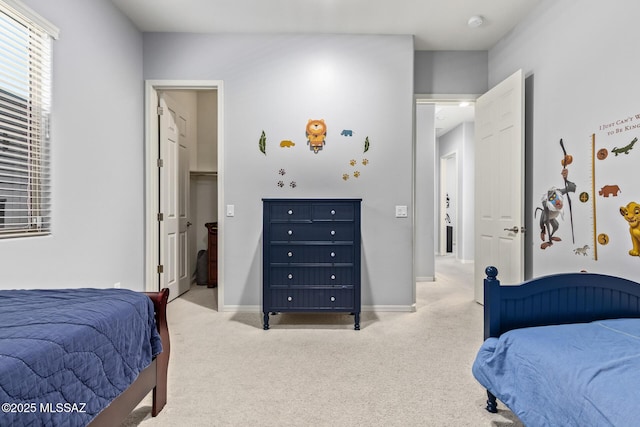 11874 N Raphael Way, Tucson, AZ 85742 - carpeted bedroom with baseboards and a walk in closet