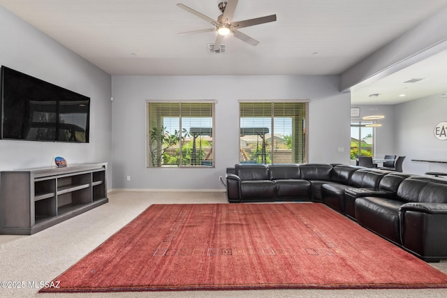 11874 N Raphael Way, Tucson, AZ 85742 - living room with ceiling fan, carpet floors, and baseboards