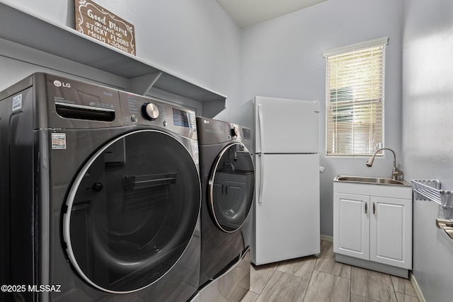 11874 N Raphael Way, Tucson, AZ 85742 - laundry area with independent washer and dryer, cabinet space, and baseboards