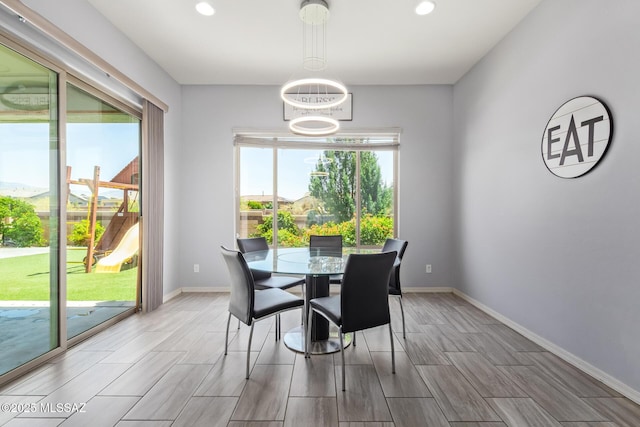 11874 N Raphael Way, Tucson, AZ 85742 - dining room featuring baseboards, wood tiled floors, and recessed lighting