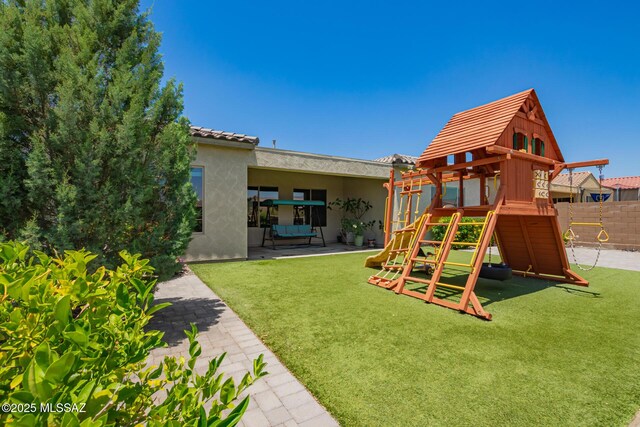 11874 N Raphael Way, Tucson, AZ 85742 - view of jungle gym with a lawn and a patio