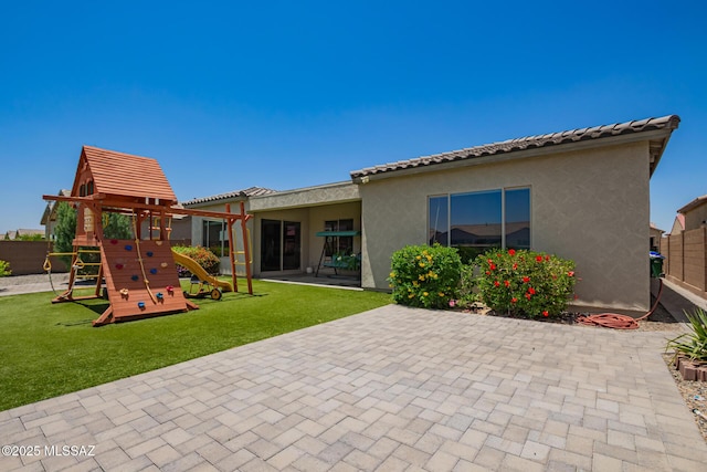 11874 N Raphael Way, Tucson, AZ 85742 - rear view of house with a patio, a playground, and stucco siding