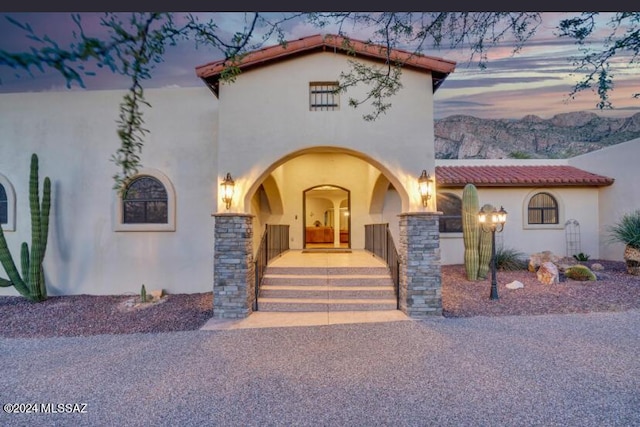 9710 N Cliff View Pl, Oro Valley, AZ 85704 - mediterranean / spanish home featuring stucco siding, a tiled roof, and covered porch