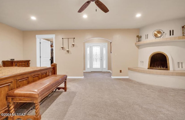 9710 N Cliff View Pl, Oro Valley, AZ 85704 - living room with a ceiling fan, recessed lighting, baseboards, light colored carpet, and a tile fireplace
