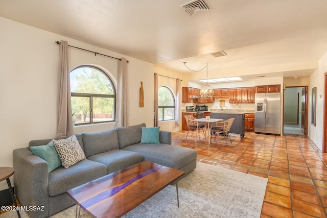 9710 N Cliff View Pl, Oro Valley, AZ 85704 - living area with a chandelier and light tile patterned floors