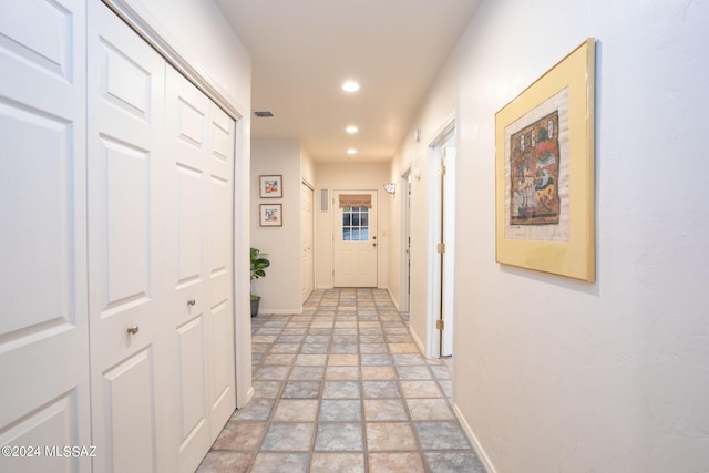 9710 N Cliff View Pl, Oro Valley, AZ 85704 - hallway with stone tile floors, baseboards, and recessed lighting