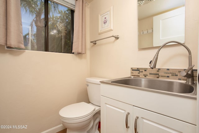 9710 N Cliff View Pl, Oro Valley, AZ 85704 - half bathroom featuring vanity, toilet, and baseboards