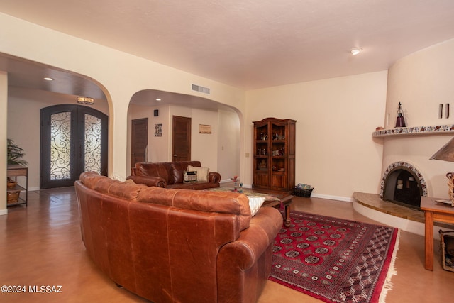 9710 N Cliff View Pl, Oro Valley, AZ 85704 - living room with arched walkways, baseboards, and french doors