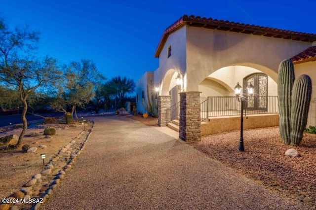 9710 N Cliff View Pl, Oro Valley, AZ 85704 - view of home's exterior with stucco siding and a tile roof