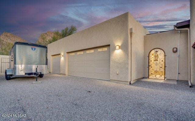 9710 N Cliff View Pl, Oro Valley, AZ 85704 - view of front facade with stucco siding and an attached garage
