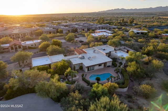 9710 N Cliff View Pl, Oro Valley, AZ 85704 - aerial view at dusk of view of pool, a mountain view, and a residential view