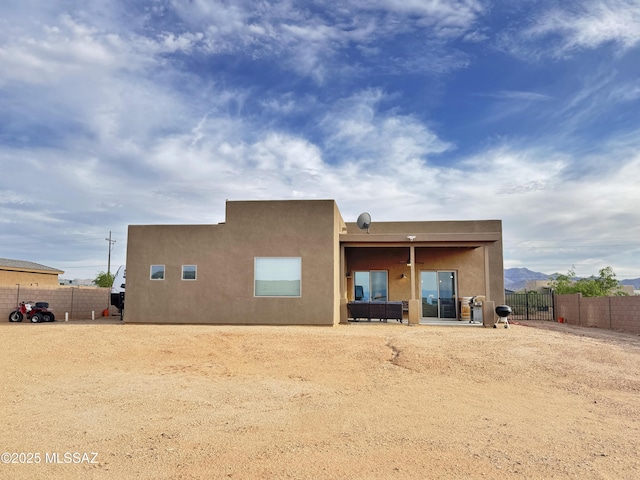 3335 E Canyoneer Pl, Vail, AZ 85641 - rear view of property featuring stucco siding and a patio area