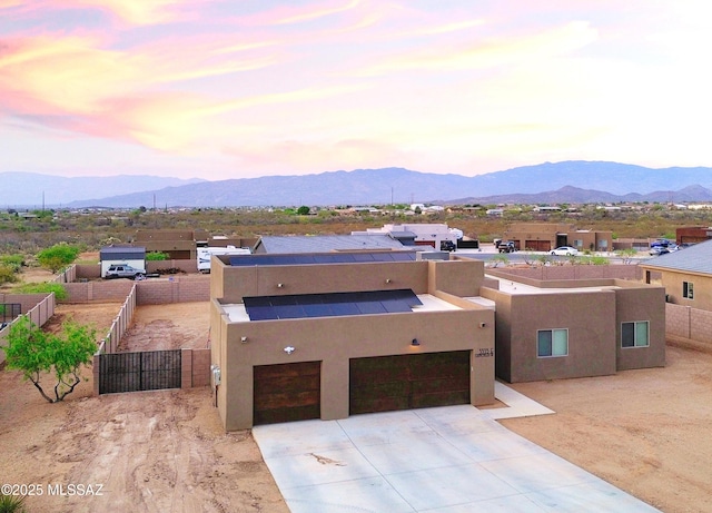 3335 E Canyoneer Pl, Vail, AZ 85641 - view of front of home featuring driveway, stucco siding, a mountain view, and a gate