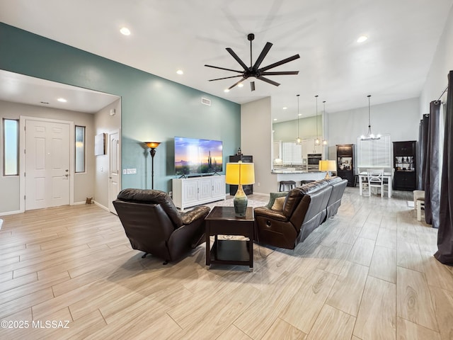 3335 E Canyoneer Pl, Vail, AZ 85641 - living area with a chandelier, a ceiling fan, light wood finished floors, recessed lighting, and baseboards