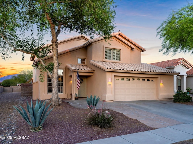 9880 E Cisco Ct, Tucson, AZ 85748 - mediterranean / spanish house featuring stucco siding, driveway, and a tile roof