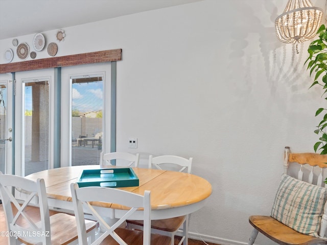 9880 E Cisco Ct, Tucson, AZ 85748 - dining space featuring a chandelier and baseboards