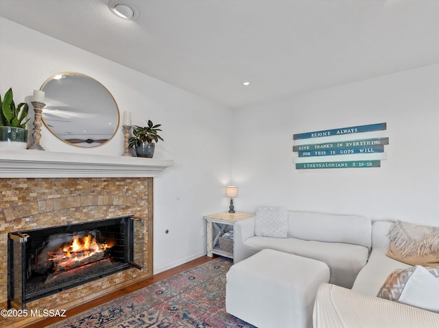 9880 E Cisco Ct, Tucson, AZ 85748 - living room featuring a tile fireplace, wood finished floors, baseboards, and recessed lighting