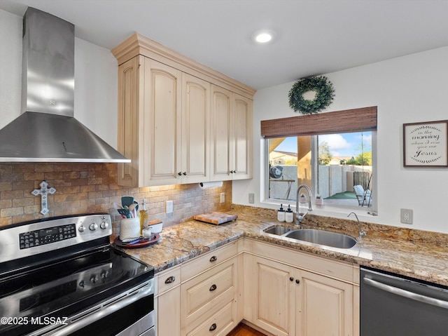 9880 E Cisco Ct, Tucson, AZ 85748 - kitchen featuring stainless steel appliances, wall chimney exhaust hood, a sink, backsplash, and light stone counters
