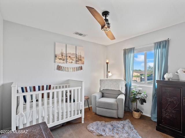 9880 E Cisco Ct, Tucson, AZ 85748 - carpeted bedroom with baseboards, a ceiling fan, and a nursery area