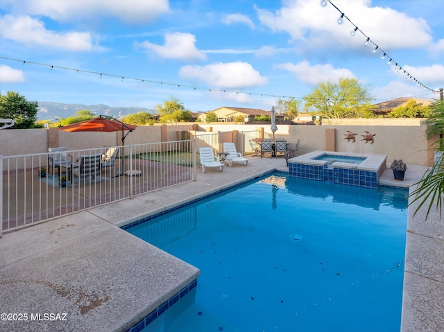 9880 E Cisco Ct, Tucson, AZ 85748 - view of swimming pool with a patio, a fenced backyard, a pool with connected hot tub, and a mountain view