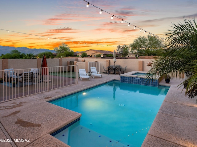 9880 E Cisco Ct, Tucson, AZ 85748 - view of pool featuring a patio, outdoor dining space, a fenced backyard, and a pool with connected hot tub