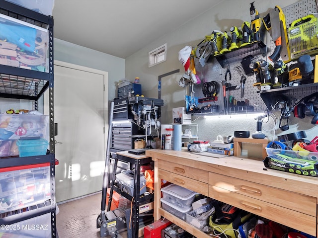 9880 E Cisco Ct, Tucson, AZ 85748 - miscellaneous room with a workshop area and concrete flooring