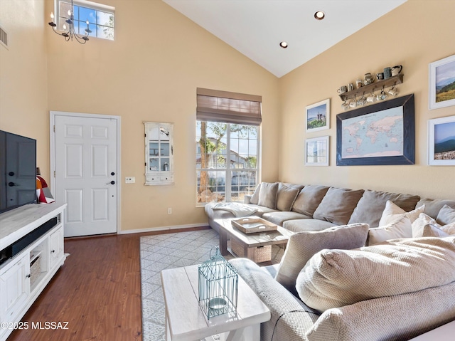 9880 E Cisco Ct, Tucson, AZ 85748 - living area with high vaulted ceiling, dark wood finished floors, a chandelier, baseboards, and recessed lighting