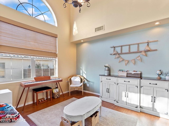 9880 E Cisco Ct, Tucson, AZ 85748 - living area with light wood-style flooring, plenty of natural light, baseboards, recessed lighting, and a chandelier