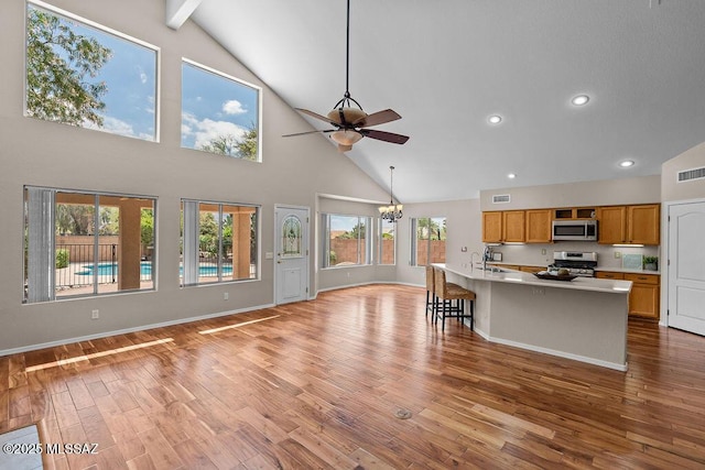 520 E Marshall Peak Dr, Oro Valley, AZ 85755 - living room with high vaulted ceiling, ceiling fan, a chandelier, light wood finished floors, and recessed lighting