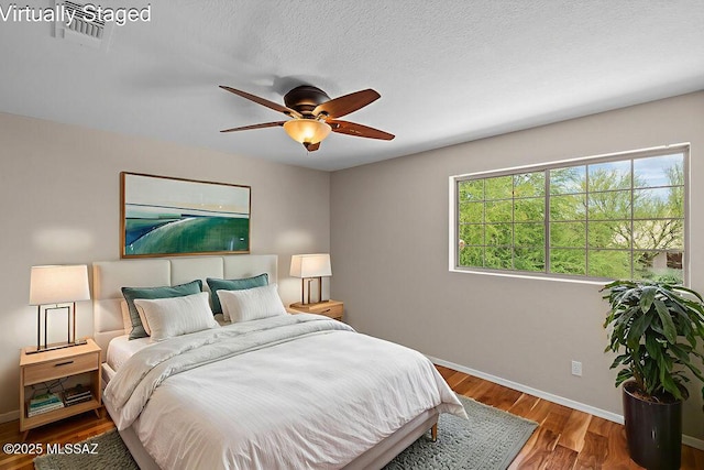 520 E Marshall Peak Dr, Oro Valley, AZ 85755 - bedroom featuring baseboards, wood finished floors, and ceiling fan