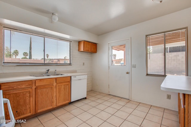 9552 E Irene St, Tucson, AZ 85730 - kitchen featuring white dishwasher, a sink, light countertops, light tile patterned flooring, and brown cabinets