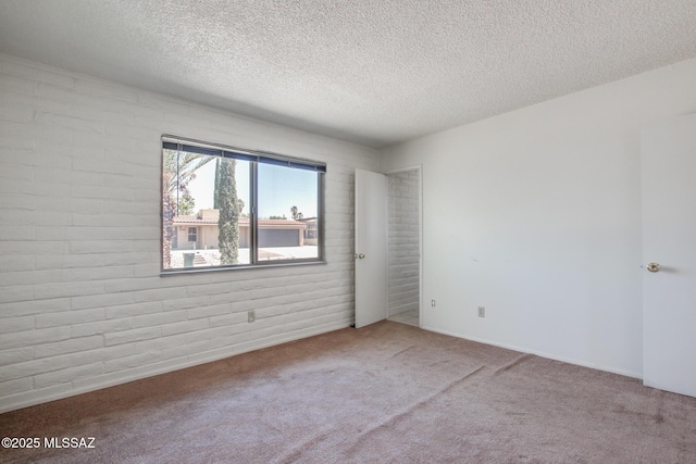 9552 E Irene St, Tucson, AZ 85730 - carpeted spare room with a textured ceiling