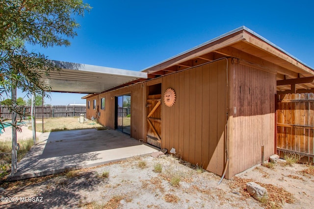 9552 E Irene St, Tucson, AZ 85730 - view of side of home with a patio area and an outdoor structure