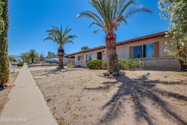 9552 E Irene St, Tucson, AZ 85730 - view of front of home featuring brick siding