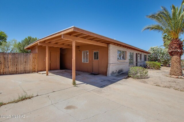 9552 E Irene St, Tucson, AZ 85730 - view of home's exterior with an attached carport and driveway