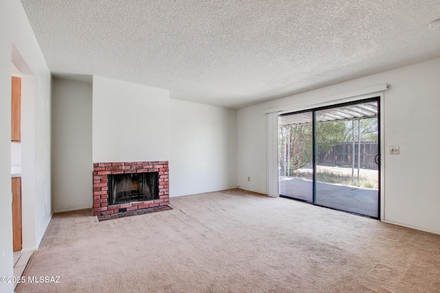 9552 E Irene St, Tucson, AZ 85730 - unfurnished living room with carpet floors, a textured ceiling, and a fireplace