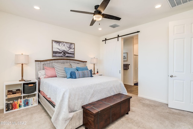 3287 W Sunlit Peak Dr, Tucson, AZ 85742 - bedroom with a barn door, carpet flooring, recessed lighting, a ceiling fan, and baseboards