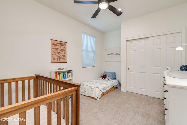3287 W Sunlit Peak Dr, Tucson, AZ 85742 - bedroom featuring light colored carpet, a closet, and a ceiling fan