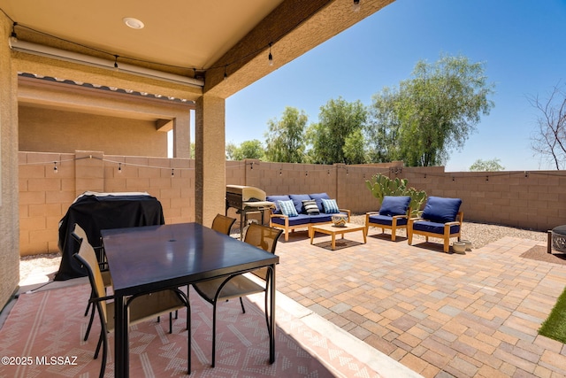 3287 W Sunlit Peak Dr, Tucson, AZ 85742 - fenced backyard with a patio, outdoor lounge area, area for grilling, and outdoor dining area
