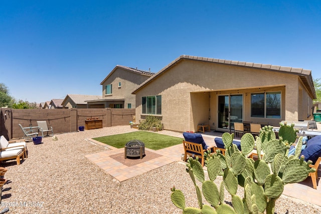3287 W Sunlit Peak Dr, Tucson, AZ 85742 - rear view of house featuring an outdoor fire pit, stucco siding, and a patio area