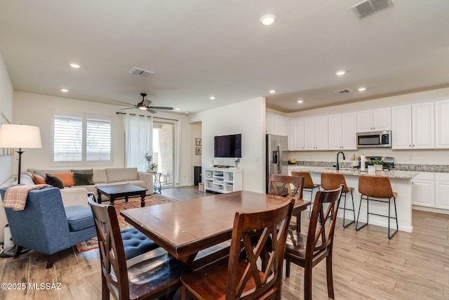3287 W Sunlit Peak Dr, Tucson, AZ 85742 - dining space with light wood-style floors, recessed lighting, and ceiling fan