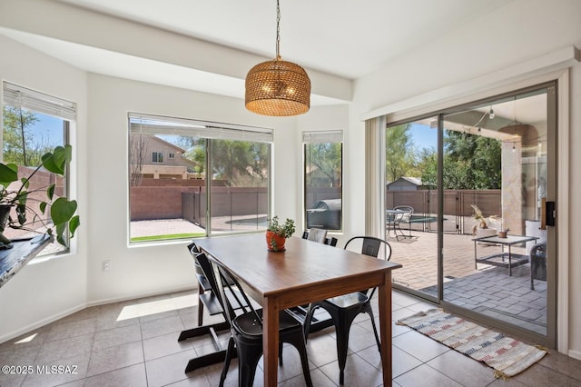 9225 S Summer Breeze Ln, Tucson, AZ 85756 - tiled dining area featuring baseboards