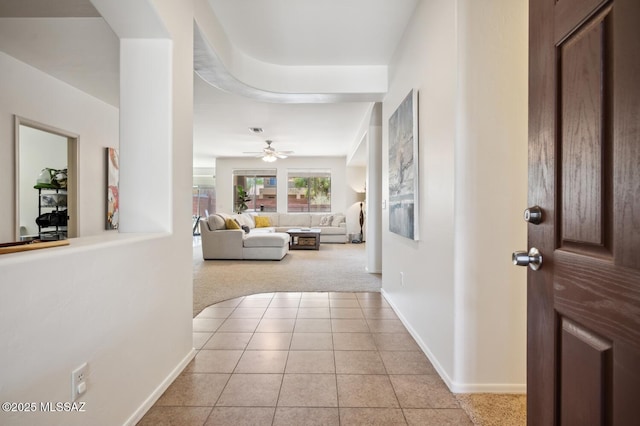 9225 S Summer Breeze Ln, Tucson, AZ 85756 - hall with light colored carpet, baseboards, and light tile patterned floors