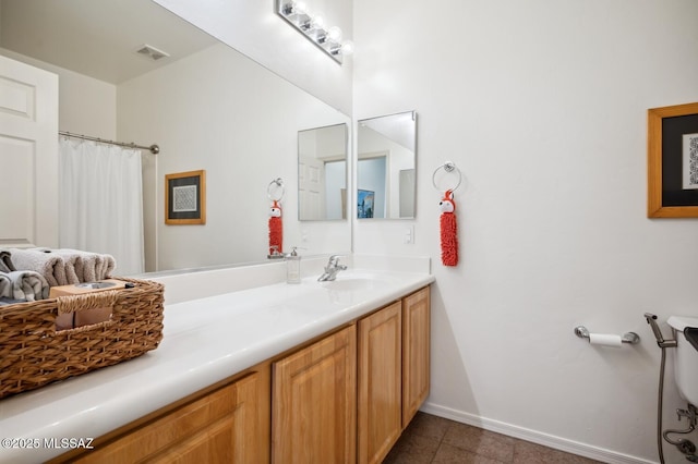 9225 S Summer Breeze Ln, Tucson, AZ 85756 - full bathroom featuring vanity, toilet, baseboards, tile patterned floors, and a shower with curtain