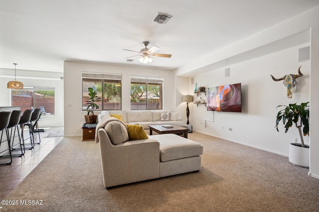 9225 S Summer Breeze Ln, Tucson, AZ 85756 - tiled living area with a ceiling fan, carpet, and baseboards