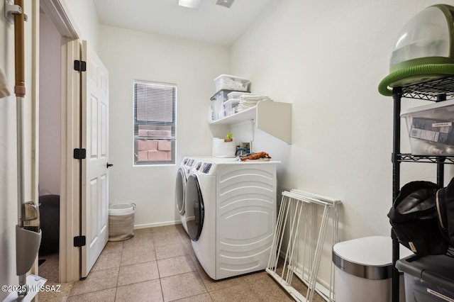9225 S Summer Breeze Ln, Tucson, AZ 85756 - laundry area featuring separate washer and dryer, baseboards, and light tile patterned floors