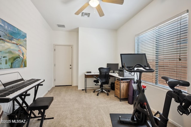 9225 S Summer Breeze Ln, Tucson, AZ 85756 - home office with ceiling fan, light carpet, and baseboards