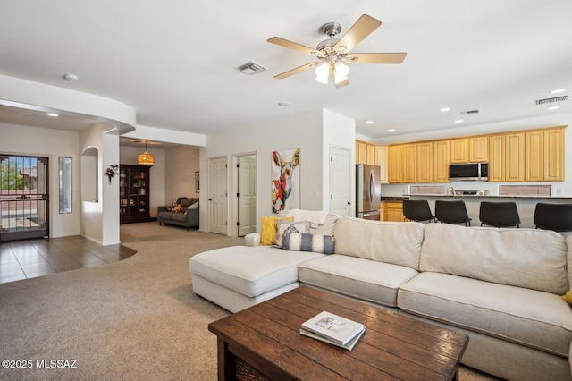 9225 S Summer Breeze Ln, Tucson, AZ 85756 - living room featuring light colored carpet, recessed lighting, light tile patterned floors, and a ceiling fan